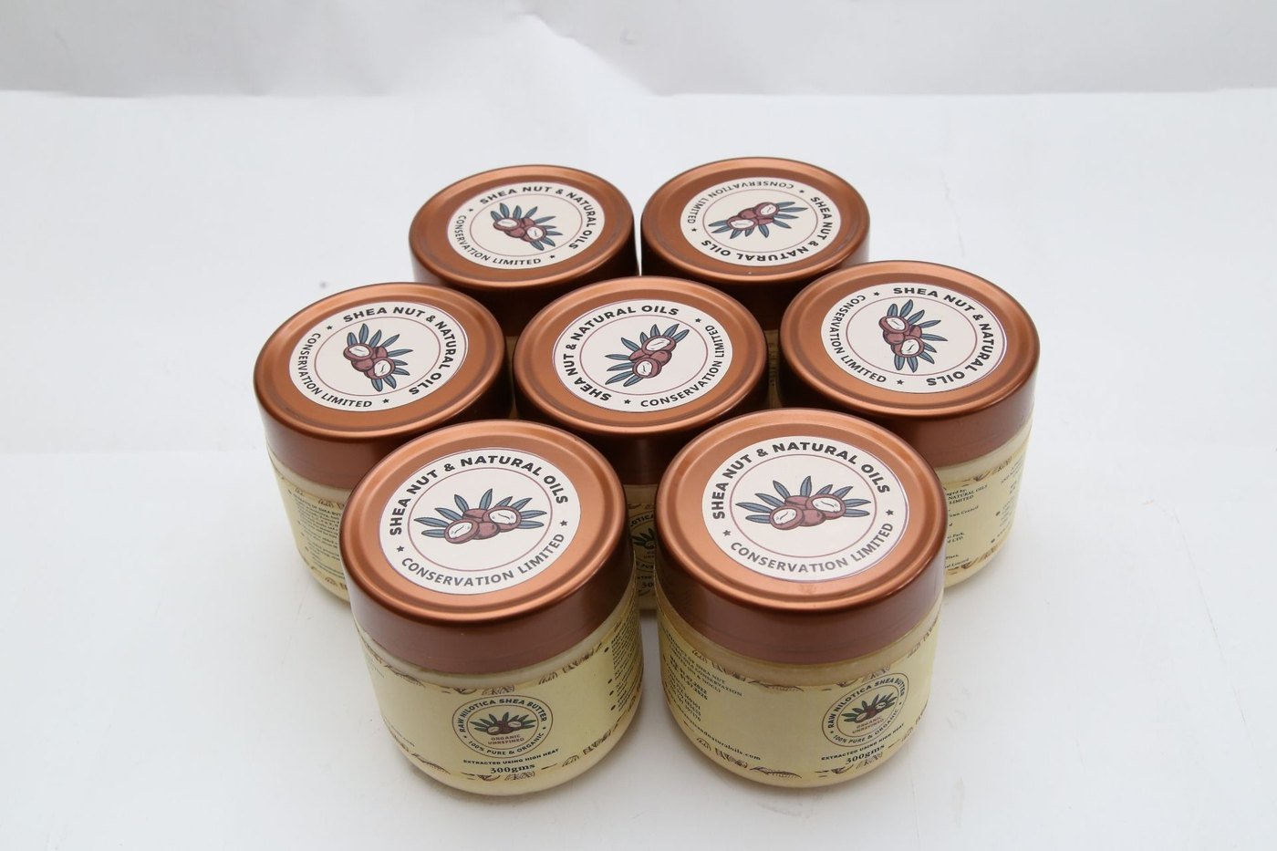 Jars of SNNOC raw Nilotica shea butter